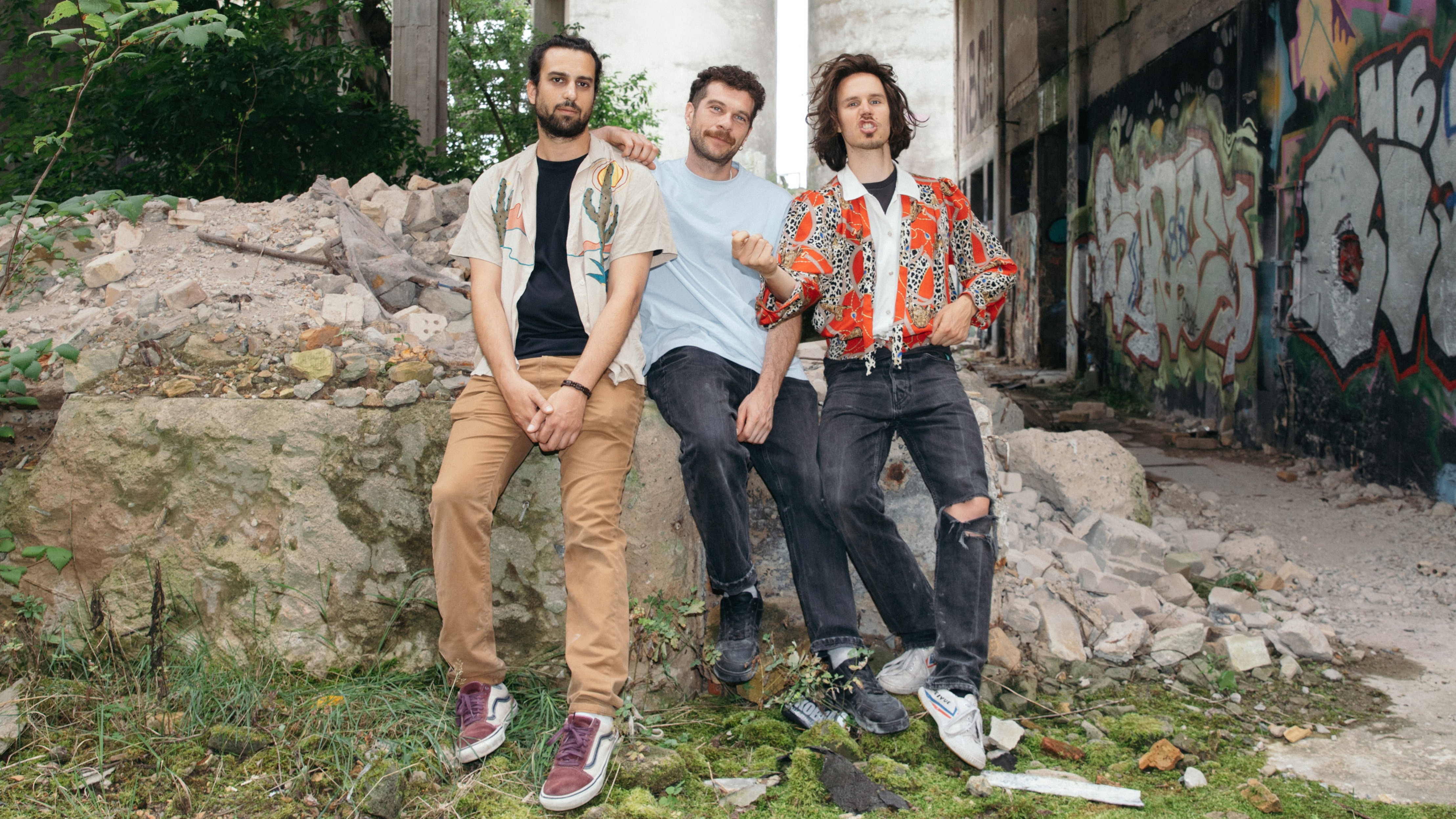 Federico, Raphael and Martin from Atomic Fruit posing in an abandoned building