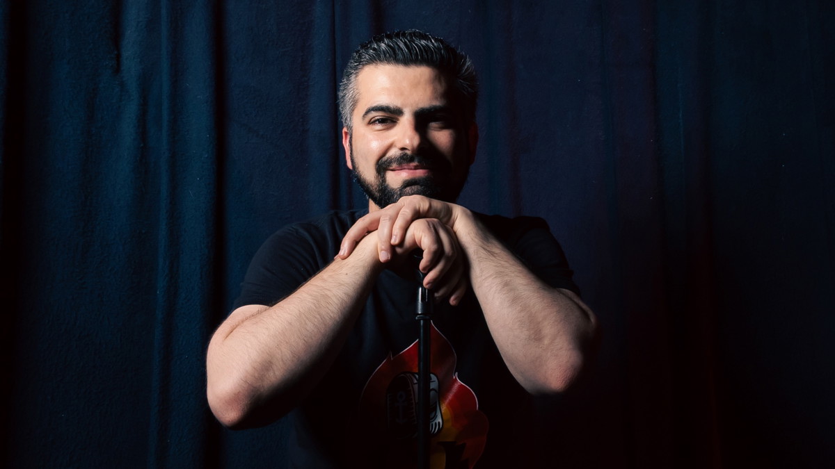 Shahin Asmari posing on the stage of Indra Music Club